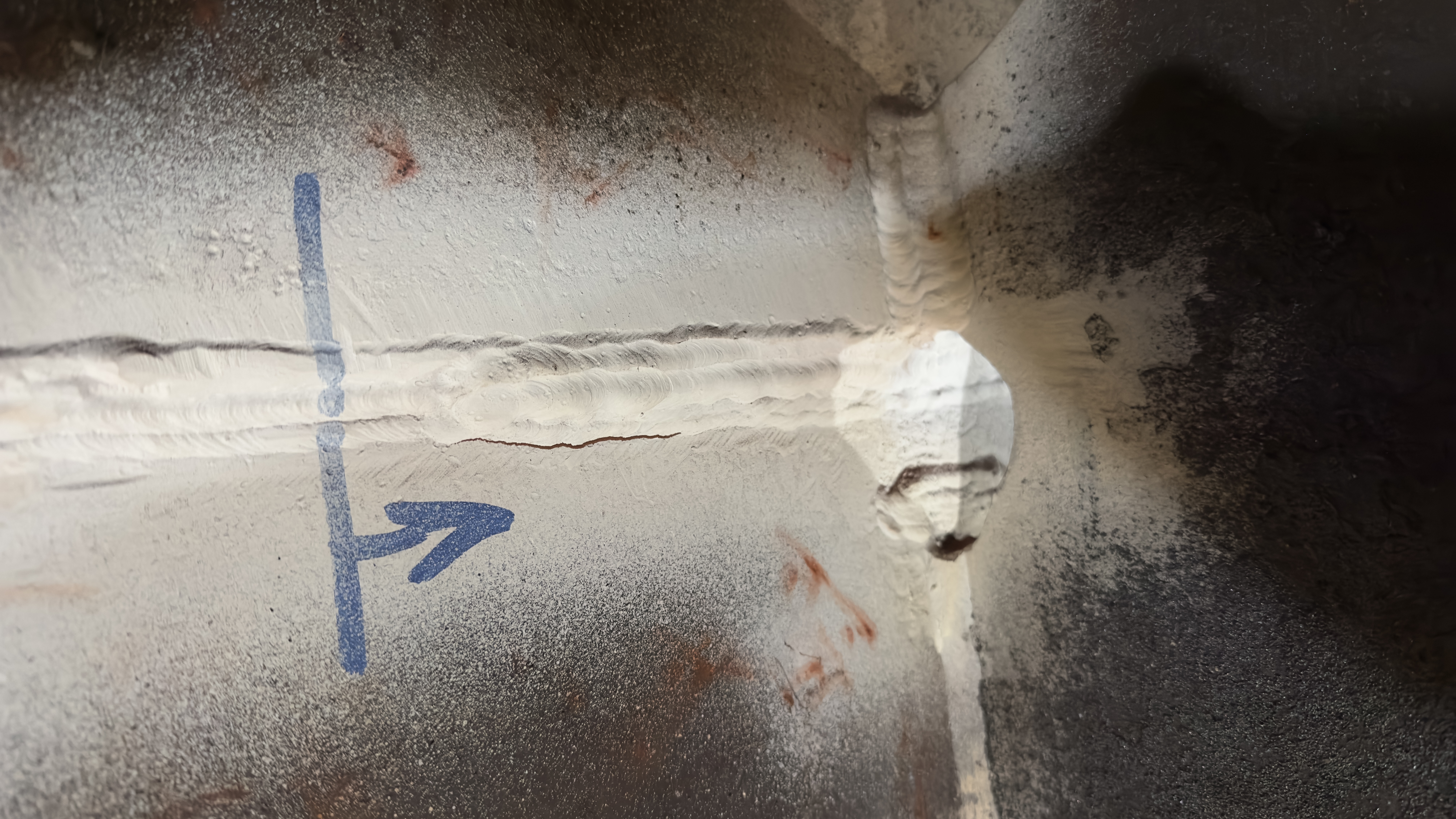 Liquid penetrant crack indication marked up on a welded component